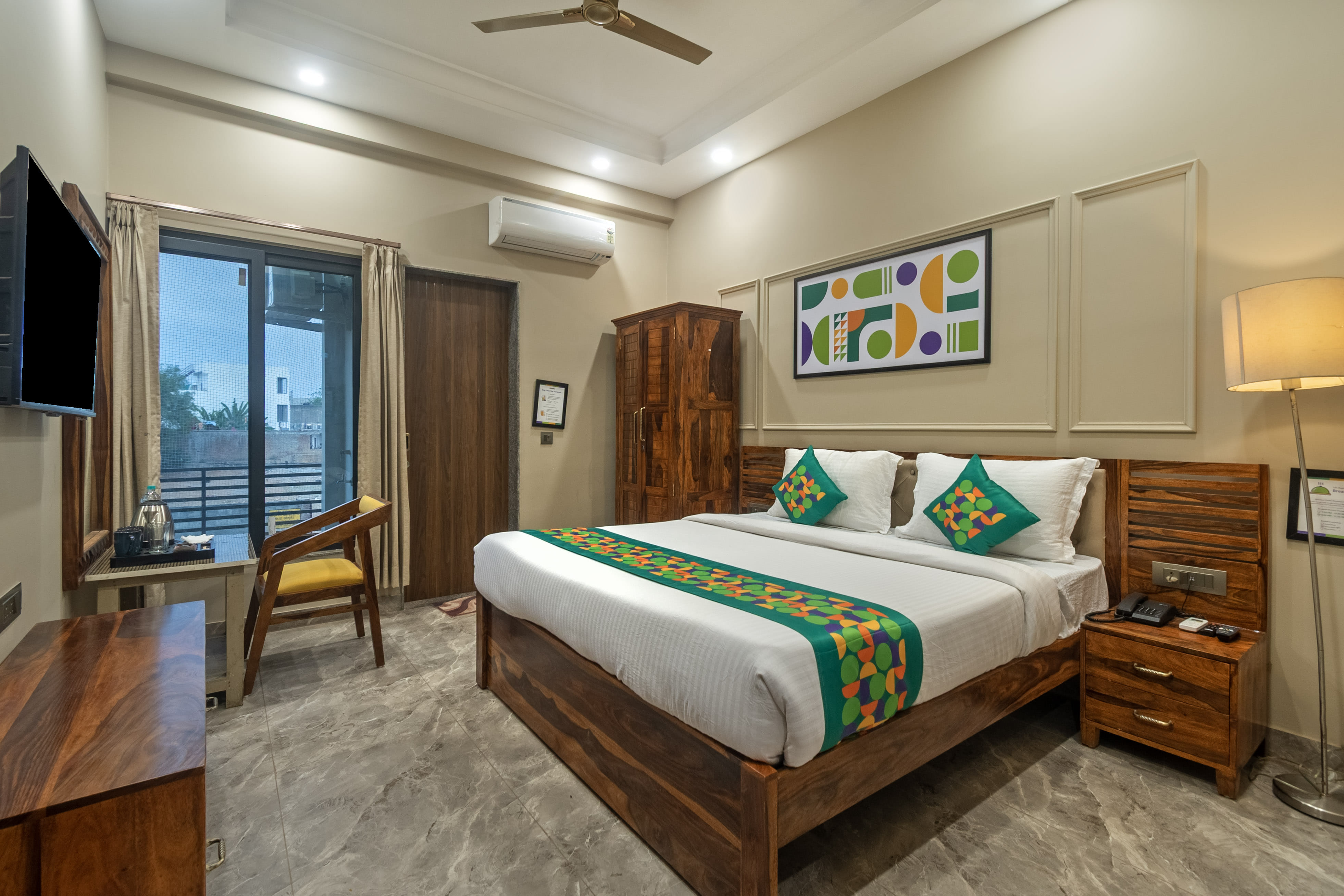 Deluxe room in Treebo Aashirwad Bliss Inn with Swimming Pool in undefined. 