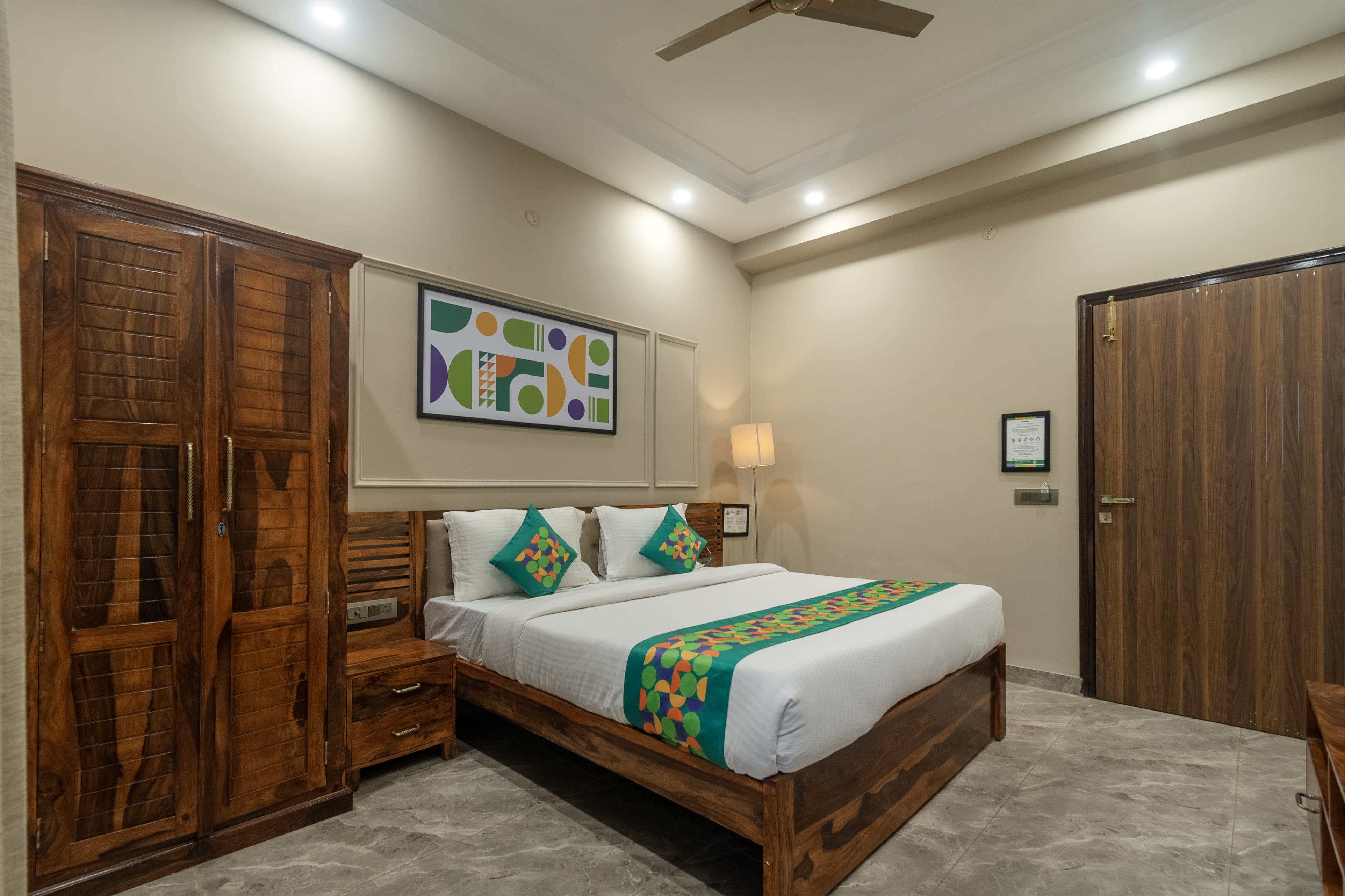 Deluxe room in Treebo Aashirwad Bliss Inn with Swimming Pool in undefined. 