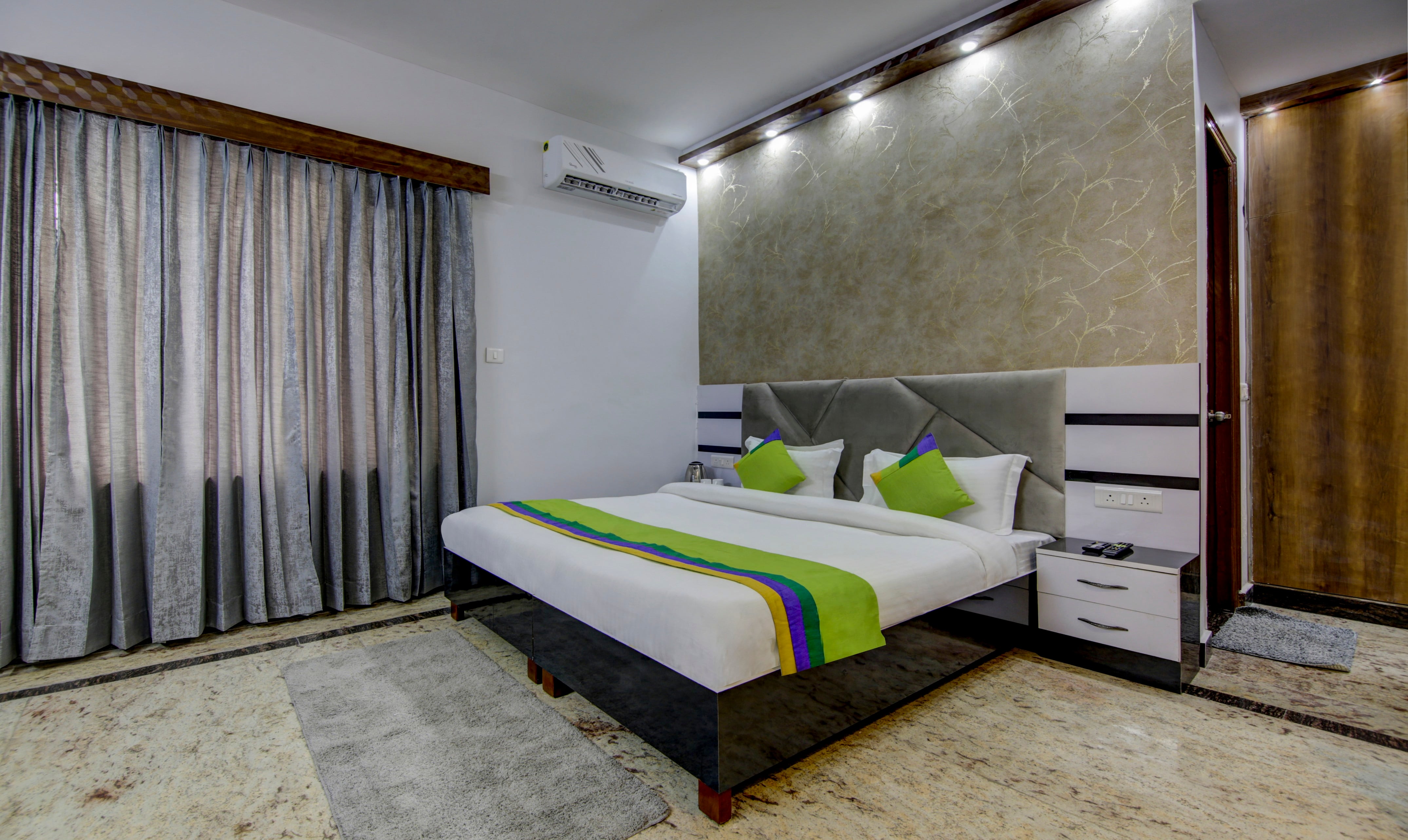Deluxe room in Treebo Avenzo in undefined. 