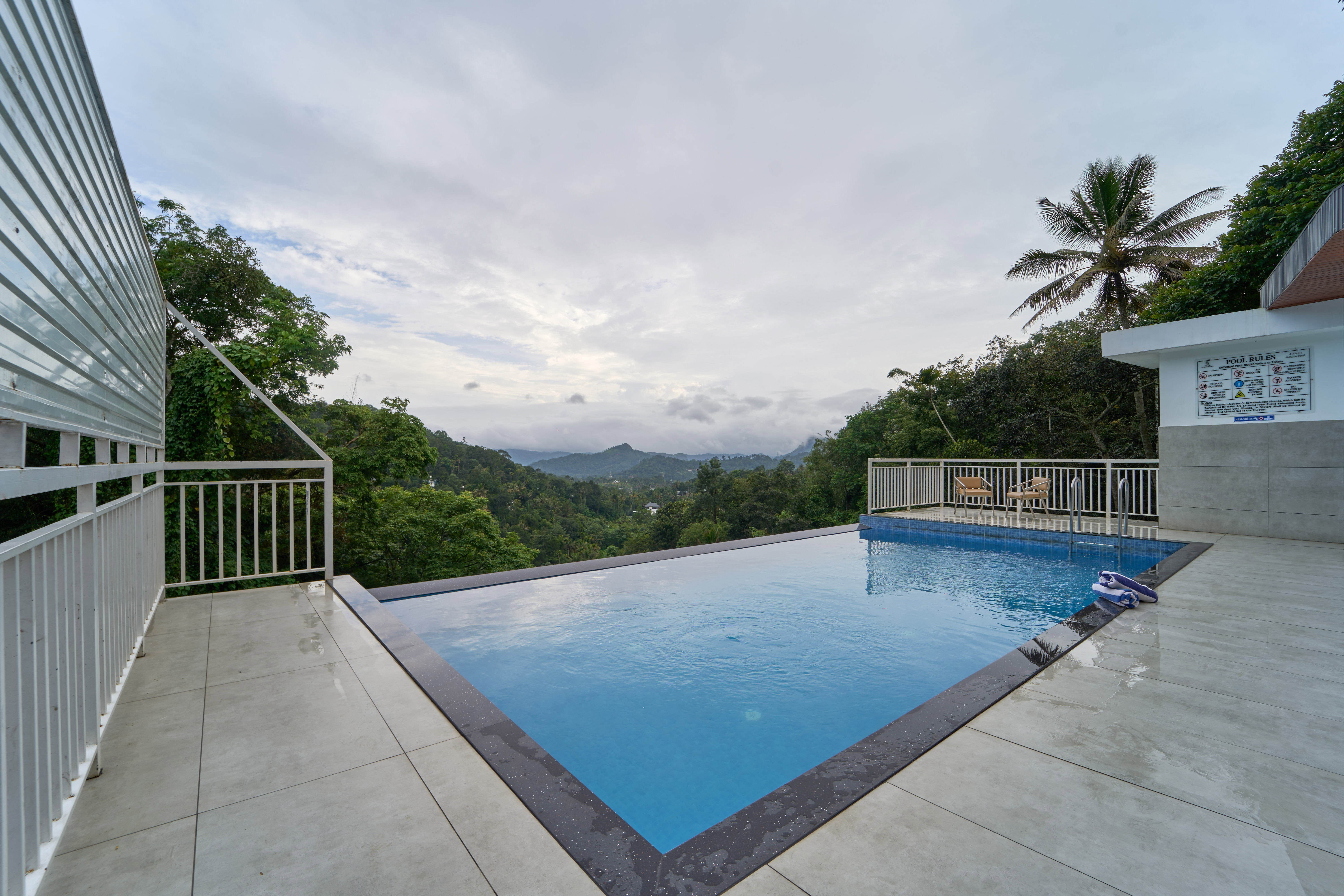The Pool of Treebo Belita Resort Munnar with Infinity Pool in undefined. 