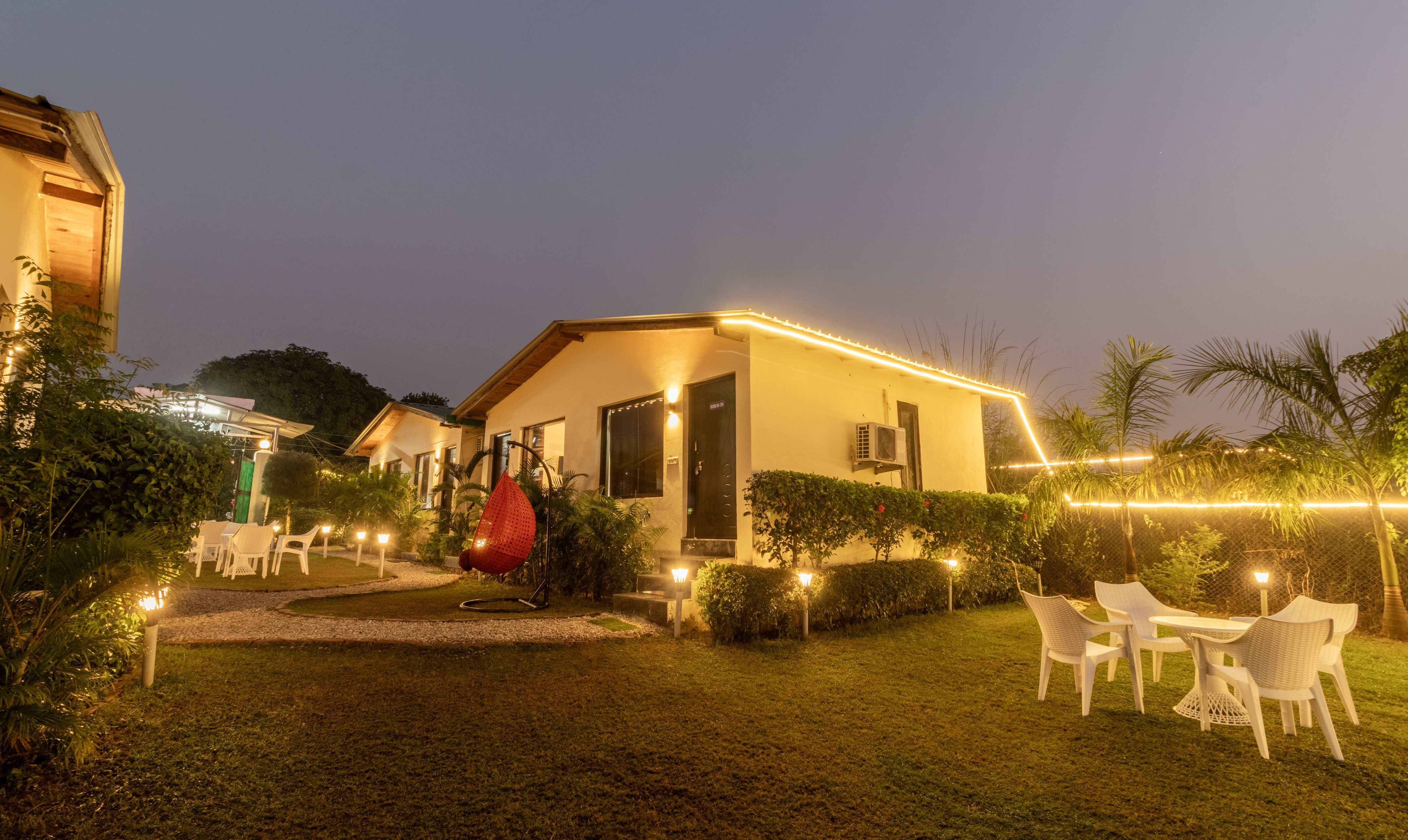 The Garden/Outdoors of Treebo Corbett Hideout Dada's with Swimming Pool in undefined. Night lights show green paths