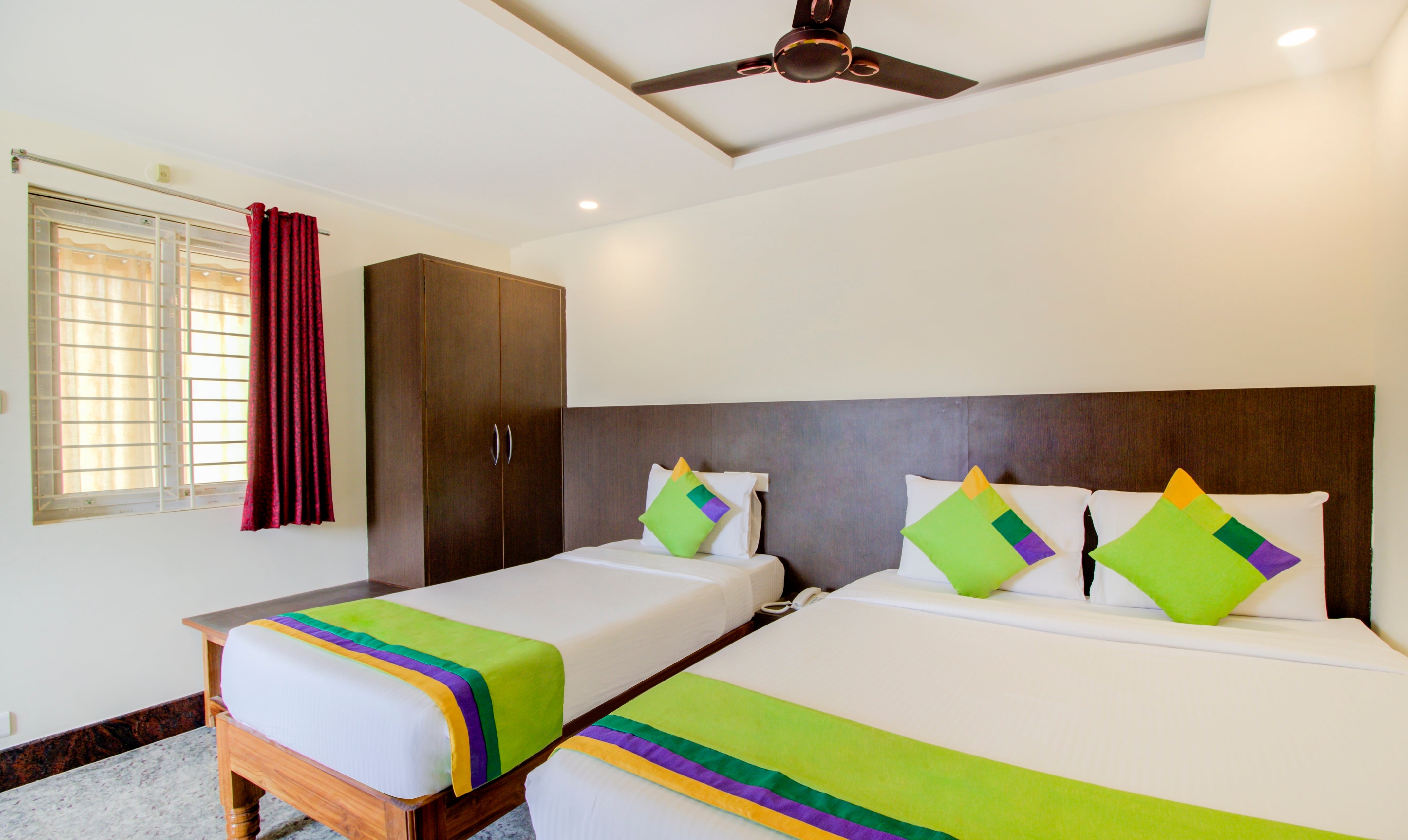 Deluxe room in Treebo Sls Grand in undefined. Bright and airy