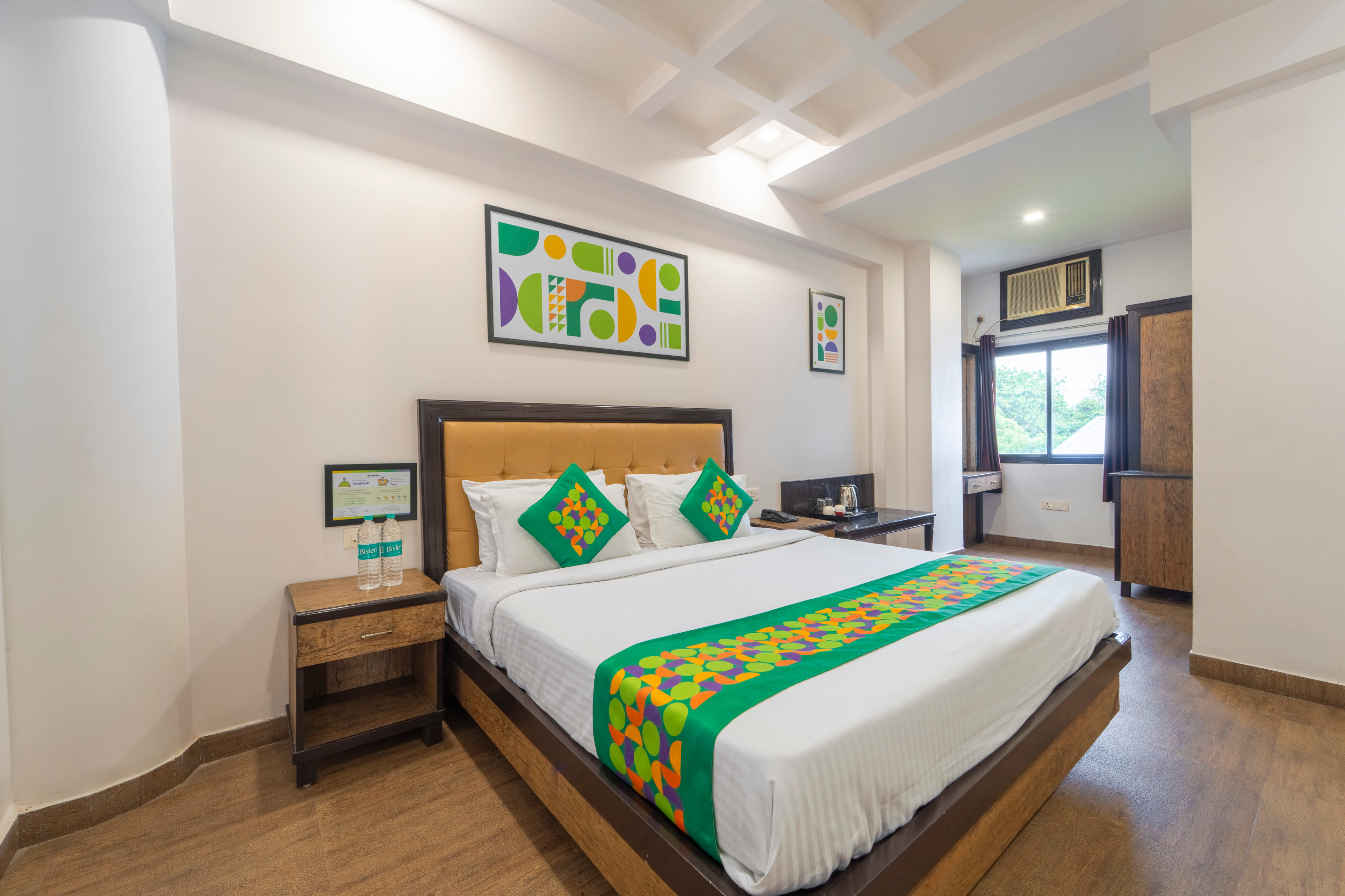 Deluxe room in Treebo Shivam Inn Near Singapore Mall in undefined.