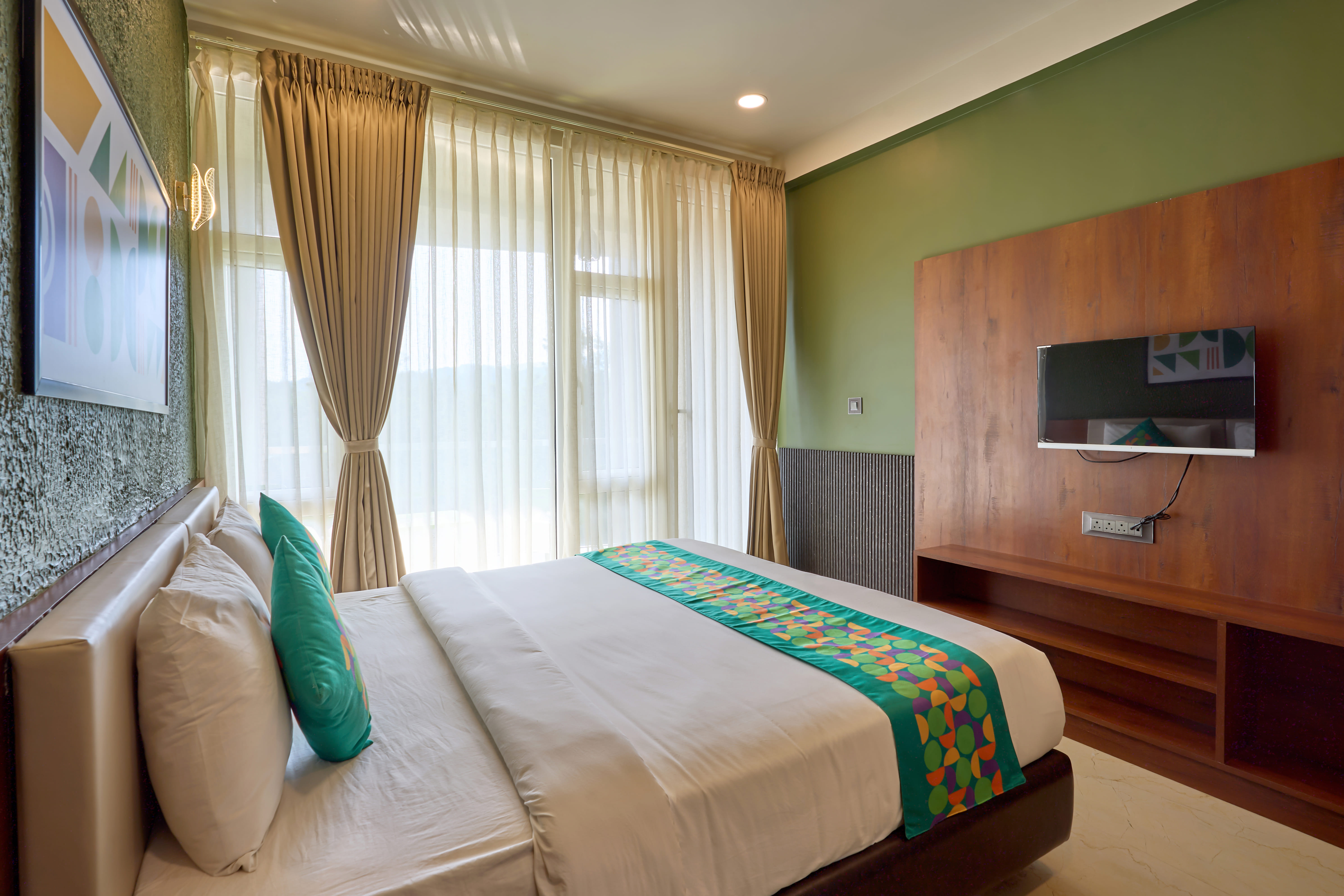 Deluxe room in Treebo Sky Vista Suites with Hill View in undefined. Deluxe