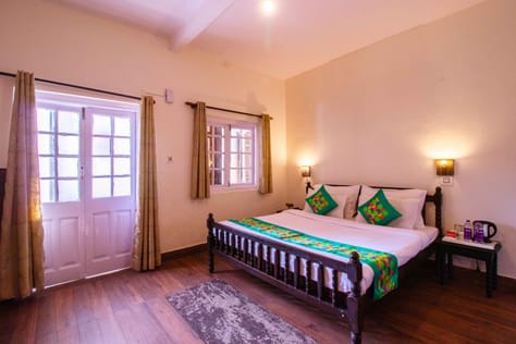 Solo room in Treebo The Alpine Heritage Residency in Shimla. 